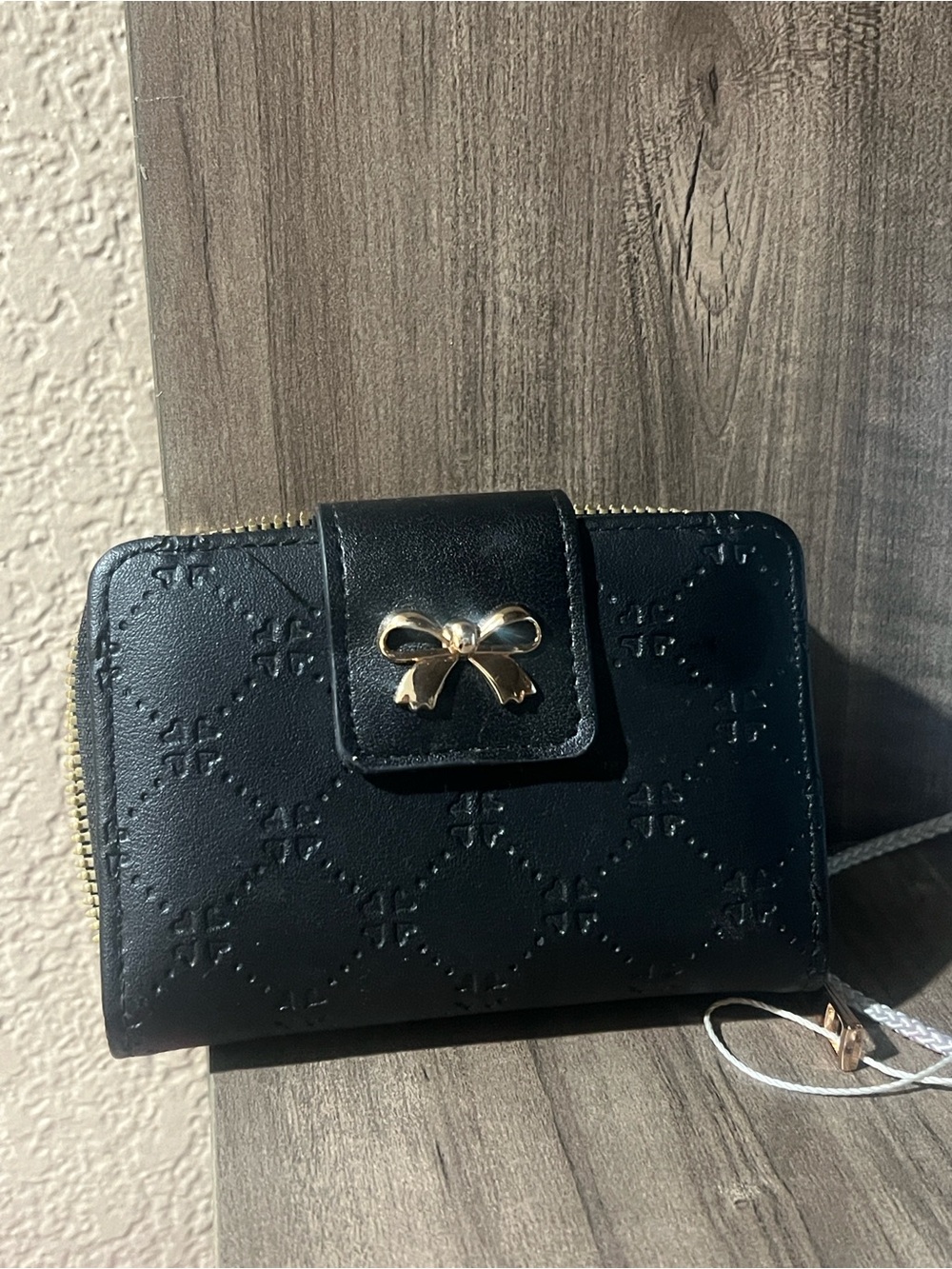 Black Quilted Wallet with Gold Bow Accent
